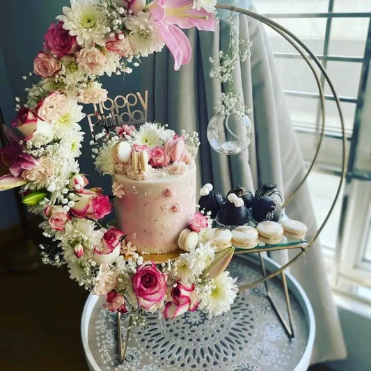 Elegant Mettallic Cake Stand with Imported Flowers Arrangement and Desserts Display