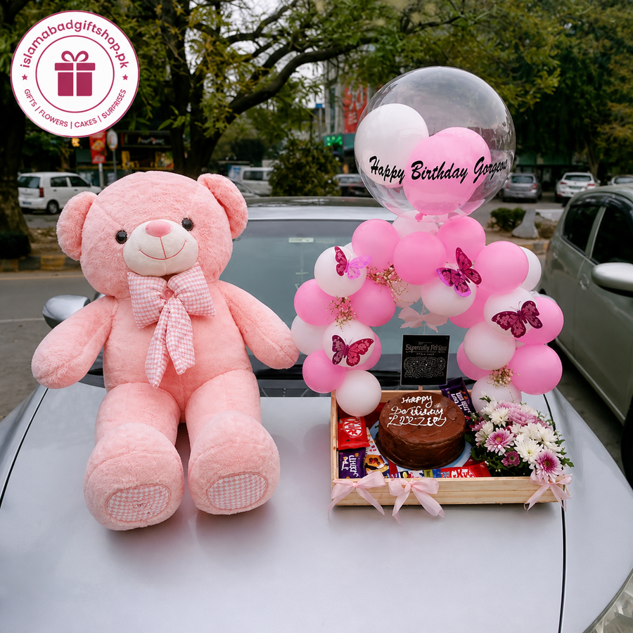 Pink teddy bear birthday gift set with Happy Birthday Gorgeous balloons, chocolate cake, flowers, candies