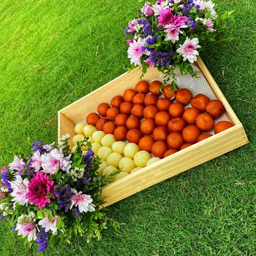 Luxurious Mithai Tray with Floral Decoration โ Featuring Gulab Jamun & Rasgulla