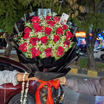 Elegant Red Roses with Bold Black Wrap