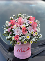 A stylish flower box arrangement with pink and white chrysanthemums and roses, featuring a “Best Mom Ever”
