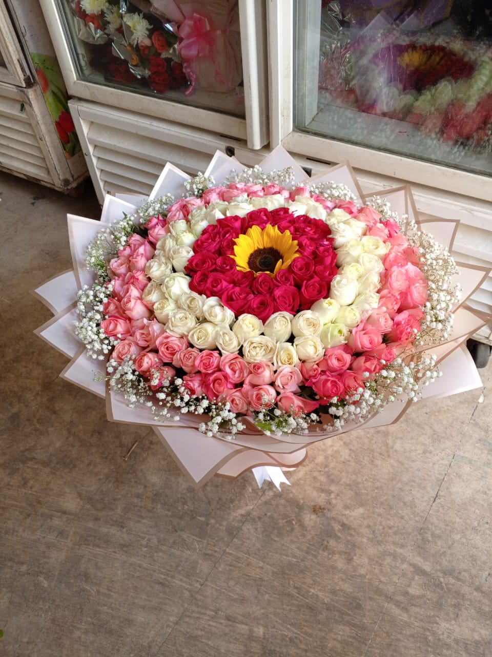 Stunning Mixed Rose Bouquet with Sunflower Centerpiece