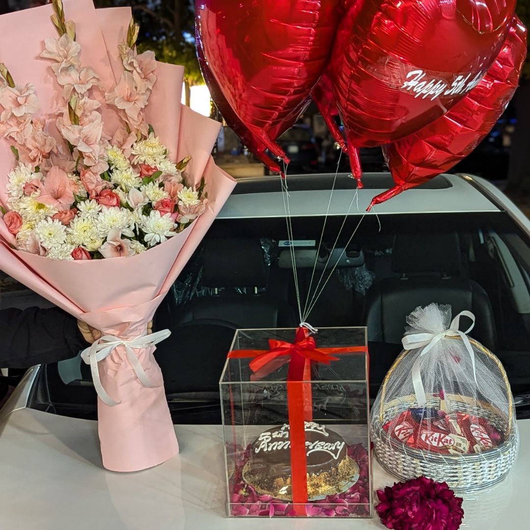 Eid Deal – Chocolate Basket, Flower Bouquet, Acrylic Box with Cake & Red Heart Balloons