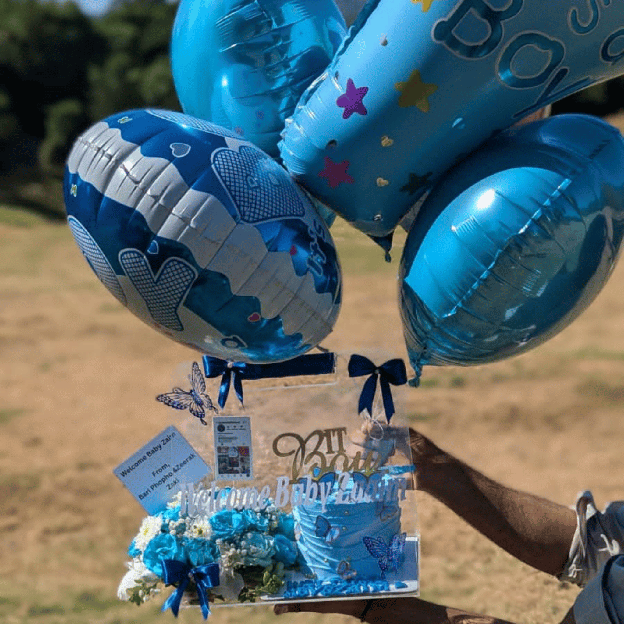 “Little Prince Welcome Set” – Acrylic Bag with Flowers, Cake & ‘It’s a Boy’ Foil Balloons