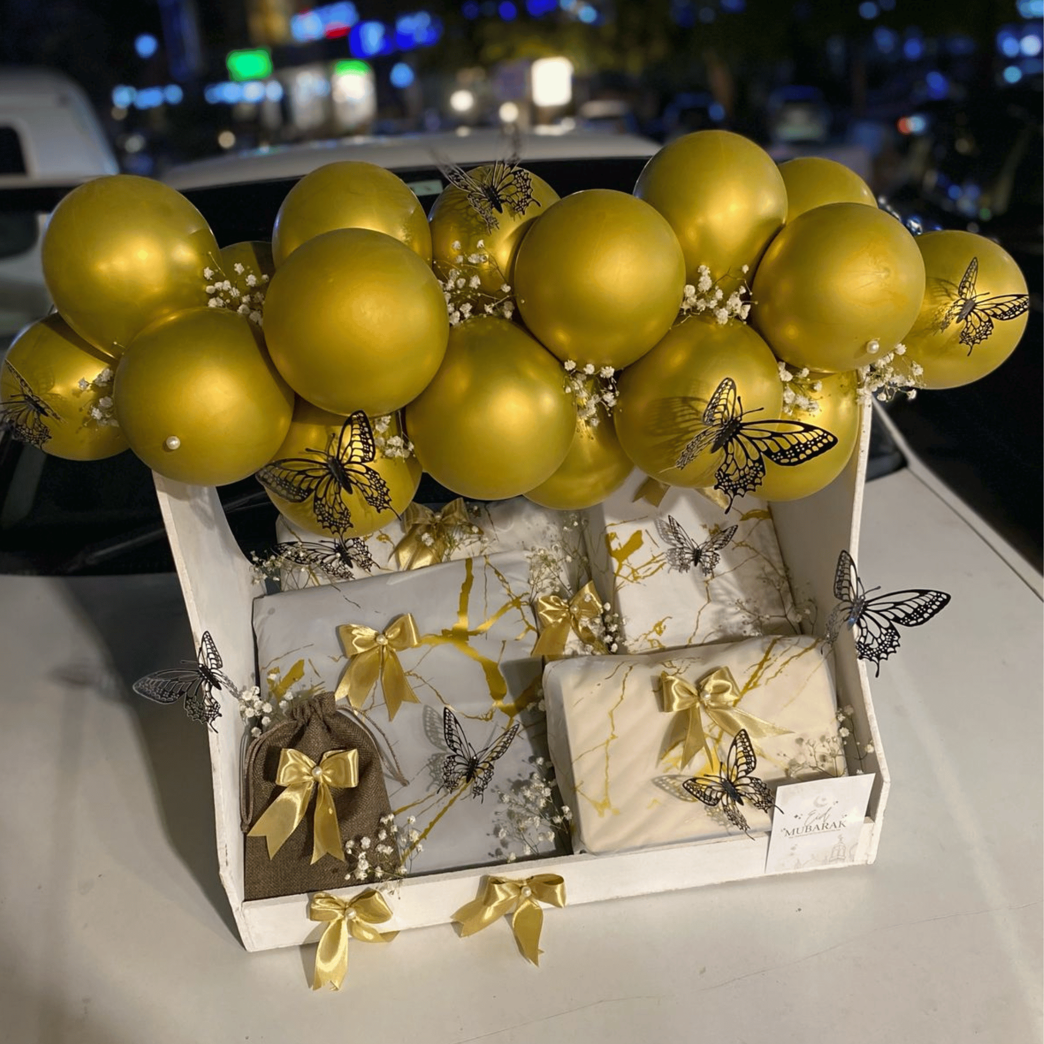 Golden Elegance Gift Basket” – Dress, Bag, Perfume with White & Gold Balloon Décor