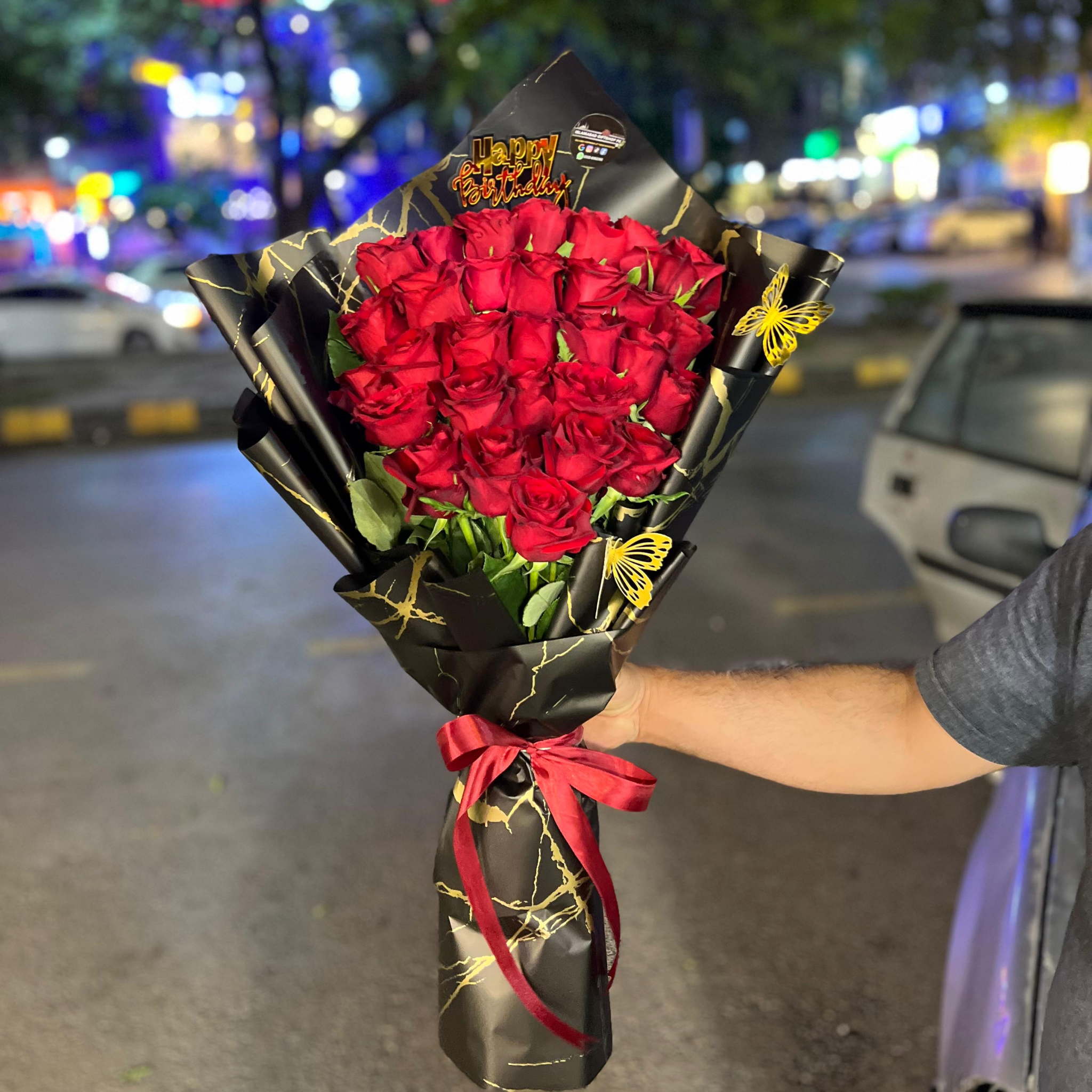 Luxury Red Roses Wrapped in Black Wrapping Sheets
