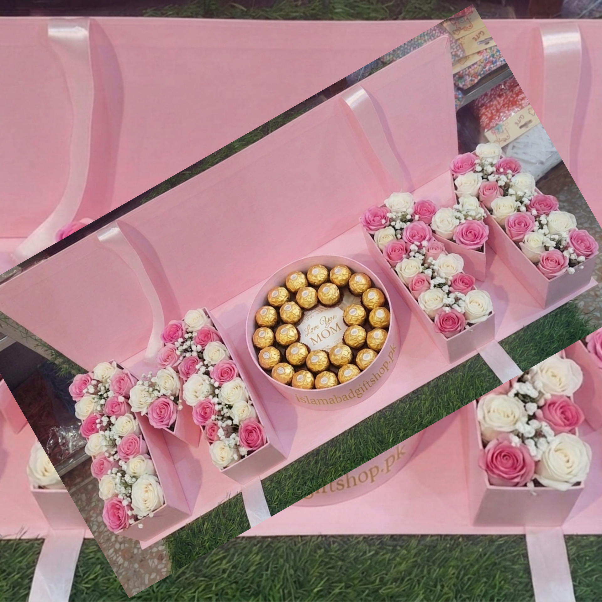 A luxury pink gift box arrangement spelling "MOM.