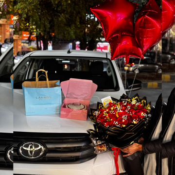 Romantic Celebration Combo – Red Roses, Cake, Brownies & Helium Balloons